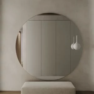 Frameless round bathroom mirror without a light and polished edge.