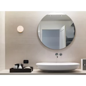 Frameless round bathroom mirror without a light and polished edge.