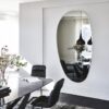 Frameless irregular mirror without a light and polished edge.