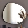 Frameless irregular mirror without a light and polished edge.